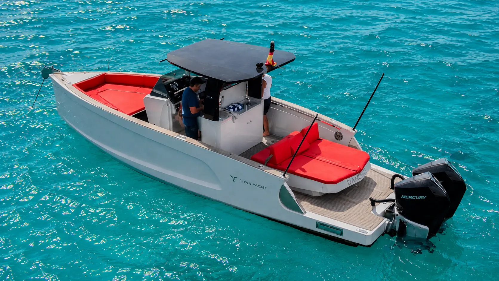 The Titan private boat on turquoise water in Ibiza